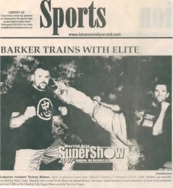 Newspaper sports feature with the headline Barker Trains With Elite