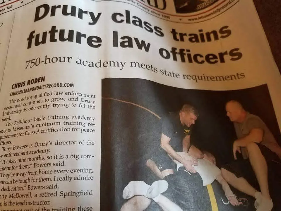 Newspaper coverage of defensive tactics training at Drury Law Enforcement Academy